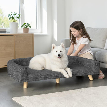 lit pour chien surélevé avec un chien et une fille